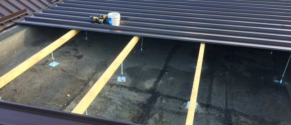 Trasformazione di coperture piane in tetto a falde Milano